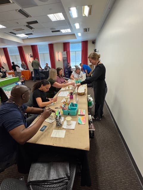 Lillian leading a corporate team paint session
