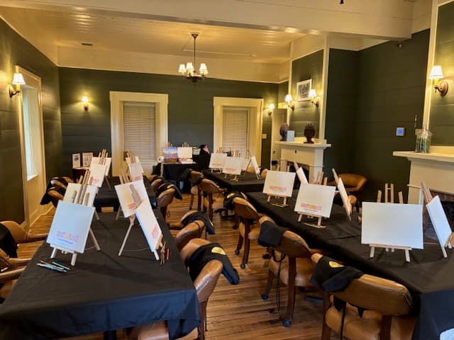 Easels and blank canvases set for a paint night